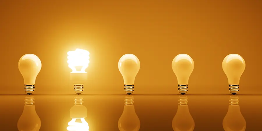 Making Sense of the Brite Advisors Distribution Plan Five lightbulbs with only one switched on, symbolising clarity in the Brite Advisors 2025 distribution plan for expat investors.