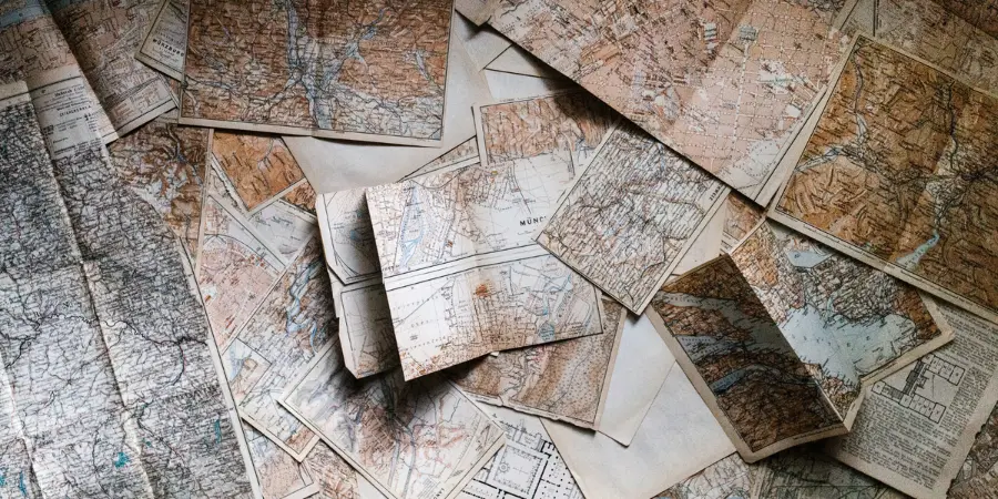 The Ultimate Guide for American Retirees Living Abroad Collection of vintage maps representing global exploration and the journey of American retirees living abroad.